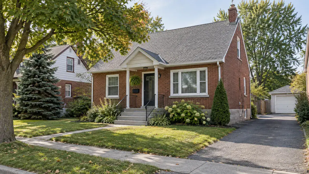Buying an older home in Sault Ste. Marie with mature trees, sidewalk, and asphalt driveway