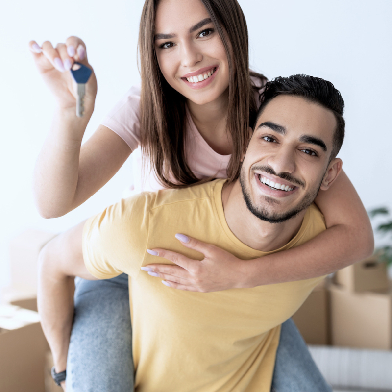 Happy couple buying a home in Sault Ste. Marie with Rob Trembinski